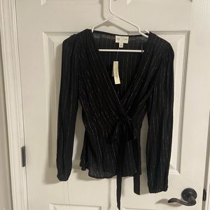 Gold and black wrap top.